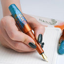 BENU Pixie Aurora Gold Fountain Pen - A Hand Writing On Paper Using Pen | EndlessPens