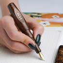BENU Pixie Coffee Brown Fountain Pen - A Hand Writing On Paper Using Pen | EndlessPens