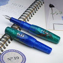 BENU Pixie Emerald Sea Fountain Pen - two Pens On Top Of Notebook | EndlessPens