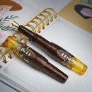 BENU Pixie Honey Bronze Fountain Pen - Two Pens On Top of Notebook | EndlessPens