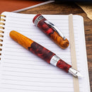 Conklin 1898 Spectra Fusion Burgundy Fountain Pen - Limited Edition (2026) - Pen and Cap Cover on Top of Notebook | EndlessPens