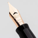 Conklin Mark Twain Crescent Black Chase with Rosegold Fountain Pen - Pen Nib Close Up | EndlessPens