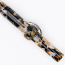 Conklin Mark Twain Crescent Orange Medley with Gunmetal Fountain Pen - Pen Leaning 45 Degrees | EndlessPens