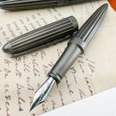 Diplomat Aero Stripes Oxyd Brass Fountain Pen - Pen onTop of Journal |  EndlessPens