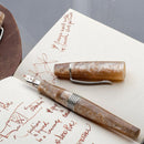 Kilk Orient Beige Fountain Pen (2024) - Pen With Exposed Nib On Top Of An Open Notebook | EndlessPens