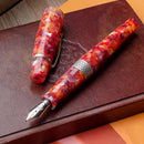 Kilk Orient Red Fountain Pen (2024) - Pen On Top of Leather Notebook | EndlessPens