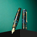 Leonardo Momento Zero 2026 Pausilya Fountain Pen (14K Gold) - Fountain pen with Nib Exposed in Green Background | EndlessPens