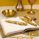 Leonardo × @twenty_sides Momento Zero Grande 2.0 Midas Fountain Pen - Fountain Pen On Top of Journal | EndlessPens