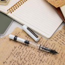 Monteverde MP1 White Lotus Fountain Pen - Pen and Cap Cover on Top of Notebook Sheets | EndlessPens