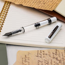 Monteverde MP1 White Lotus Fountain Pen - Pen and Cap Cover Detached on Top of Notebook | EndlessPens