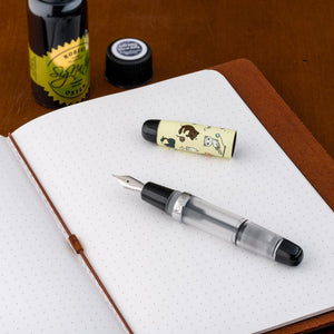 Opus 88 Mini Pocket Pen Grumpy Kitty Fountain Pen - On Top of Notebook with Ink Bottle