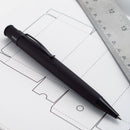 Retro 51 Tornado Vintage Metalsmith Stealth Rollerball Pen (With Ruler and Paper on Background)