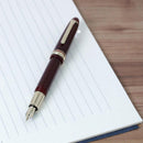 Sailor 1911L Casual Stable Fountain Pen - Muted Red on Top of Paper | EndlessPens