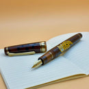 Sailor Pro Gear Iriomote Cat Fountain Pen - Limited Edition (2026) - Pen and Cap Cover on Top of Notebook | EndlessPens